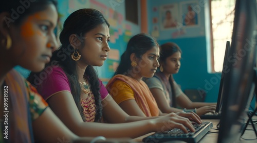 Indian School girls in Traditional Attire Learning Computer Skills in Classroom