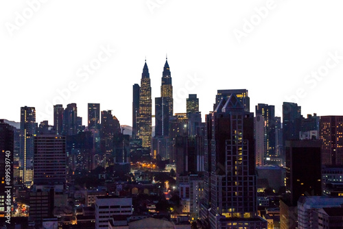 A night view of Kuala Lumpur's skyline with illuminated skyscrapers and buildings. Concept of urban nightlife and cityscapes
