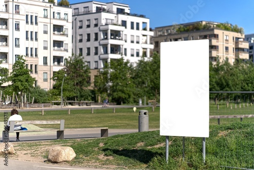 Portrait format billboard or display in a park in Berlin.