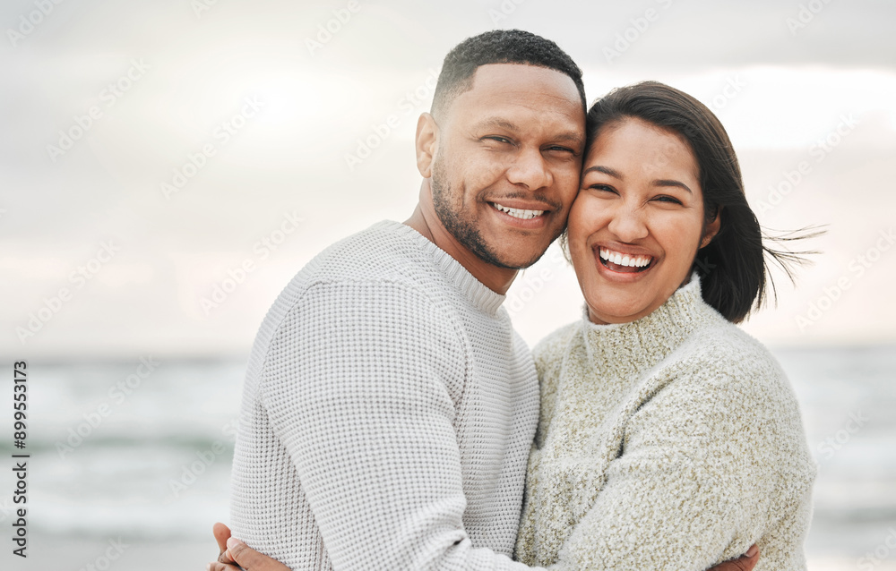 Obraz premium Travel, couple and portrait with hug on beach for love, romance or happy on holiday in Thailand. People, face and smile with embrace for bonding, affection or anniversary vacation by ocean on weekend