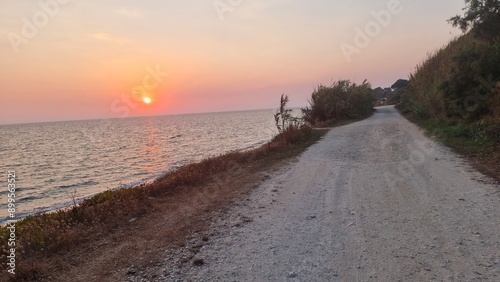 sun sunset background orange color for background in mytikas beach preveza greece photo