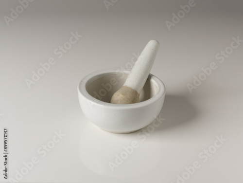 Close-up of a mortar and an empty pestle on white floor, South Korea 