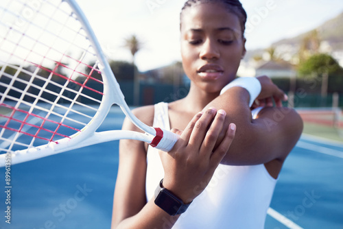 Pain, black woman and elbow injury in tennis court for athlete discomfort and muscle strain of incorrect grip. Girl, racket and arm fatigue or joint inflammation of accident, ache and young arthritis