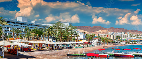 pleasured anchored motorboats and swimming area View on central beach of Eila...