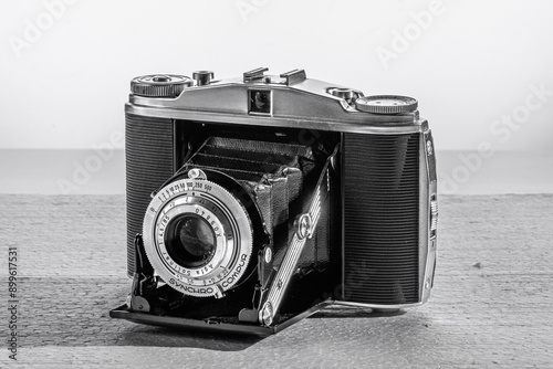 old analogue photo camera on white background
