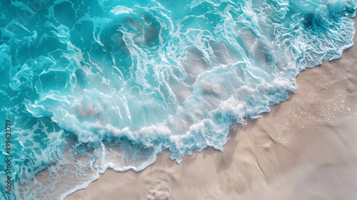 Overhead photo of crashing waves on the shoreline beach. Tropical beach surf. Abstract aerial ocean view