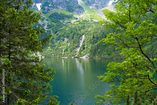 Morskie Oko, or Eye of the Sea. Beautiful mountain lake. View of the Dwoista Siklawa waterfall. Summer landscape in the Tatras photo