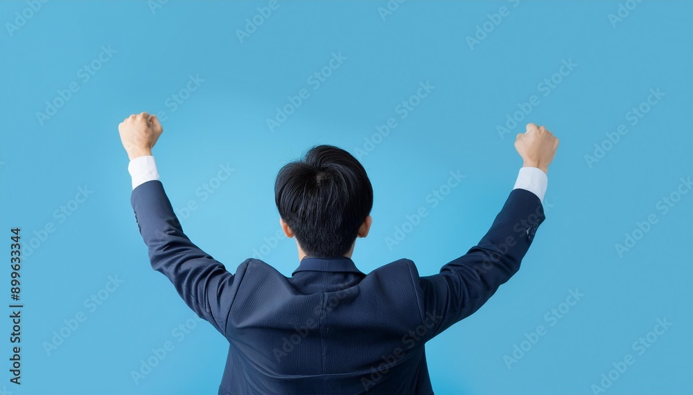 Businessman raising his fist to celebrate a deal. Businessman raising his fist to celebrate a deal.
