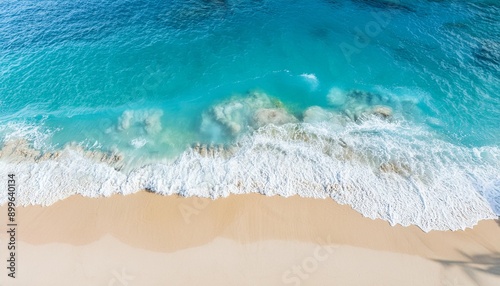 Beautiful tropical summer beach, top view of white sand and blue sea waves, nature background, vacation in paradise concept for tourism, vivid colorful.