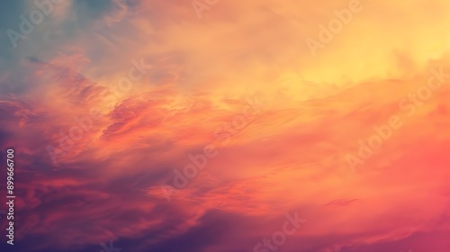 A serene sunset sky with soft clouds bathed in warm orange and pink hues, evoking a peaceful and dreamy atmosphere.