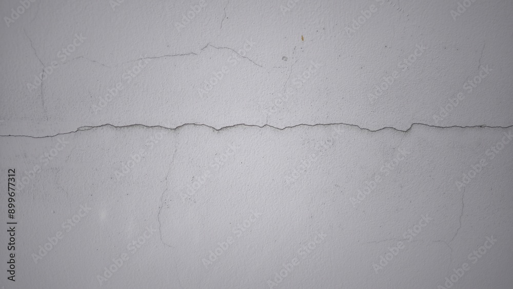 Fototapeta premium Small cracks on the white wall