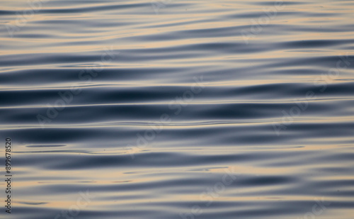 Soft waves on the calm sea surface. photo