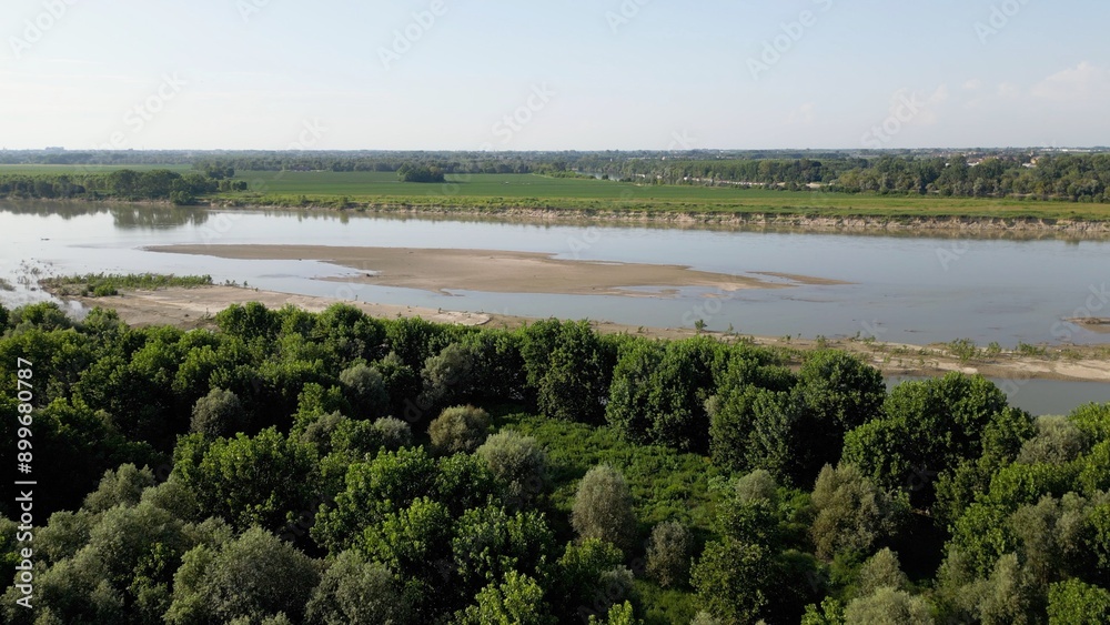 Europe, Italy, Pavia Drought and aridity river - Po and Ticino , dry beach of sand and water shortage, water emergency in Lombardy - Drone view in Ponte della Becca - Climate change global warming