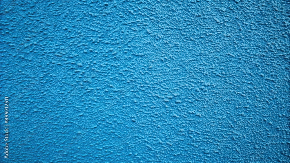 Grainy blue paint wall background with a textured finish, blue, paint, wall, background, texture, grainy, rough Grainy blue paint wall background with a textured finish, blue, paint, wall, background, texture, grainy, rough
