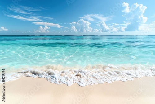 Gentle waves caress the sandy shore beneath a bright blue sky dotted with fluffy clouds, creating a serene tropical atmosphere