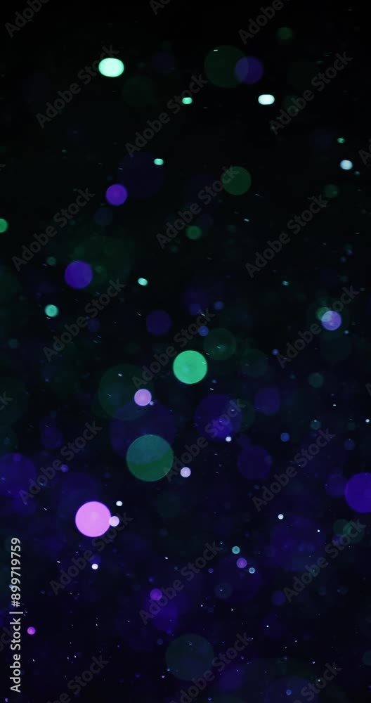 Green And Violet Circular Particles Floating In The Dark Green And Violet Circular Particles Floating In The Dark