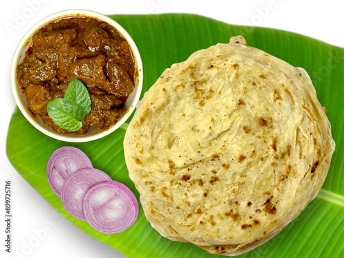 Kerala delicious food porotta and beef roast on banana leaf 