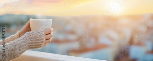 A woman enjoying her morning coffee on a balcony overlooking the city, Natural daily life, Unstaged urban morning routine photo