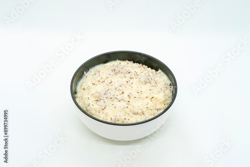 A Bowl of Rice Pudding Kheer Khir Coconut Milk Rice Shrawan 15 Khir Khane Din with Coconut Powder photo