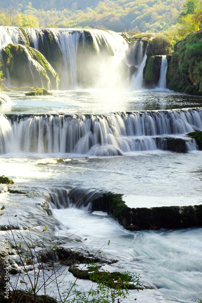 Fototapeta premium The main attraction of the Una National Park - the Strbacki Buk (Štrbački buk) waterfall. Landscape with a beautiful cascading waterfall. Nature of Bosnia and Herzegovina.