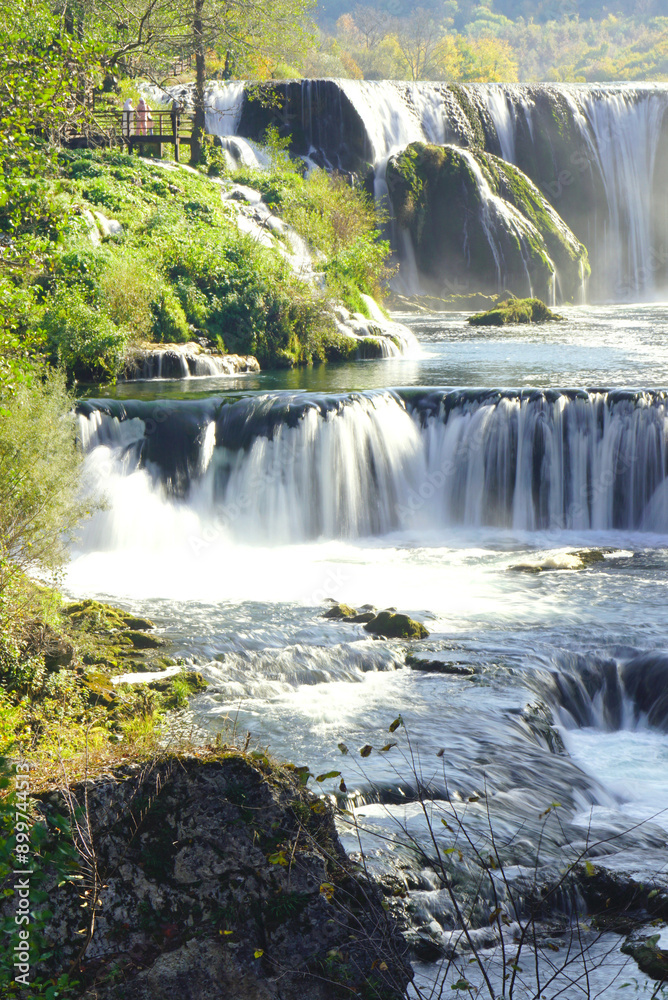 Fototapeta premium Landscape with waterfall Štrbački buk, located on the Una River. The most beautiful places in Bosnia and Herzegovina - natural attractions. View of the cascading water. 