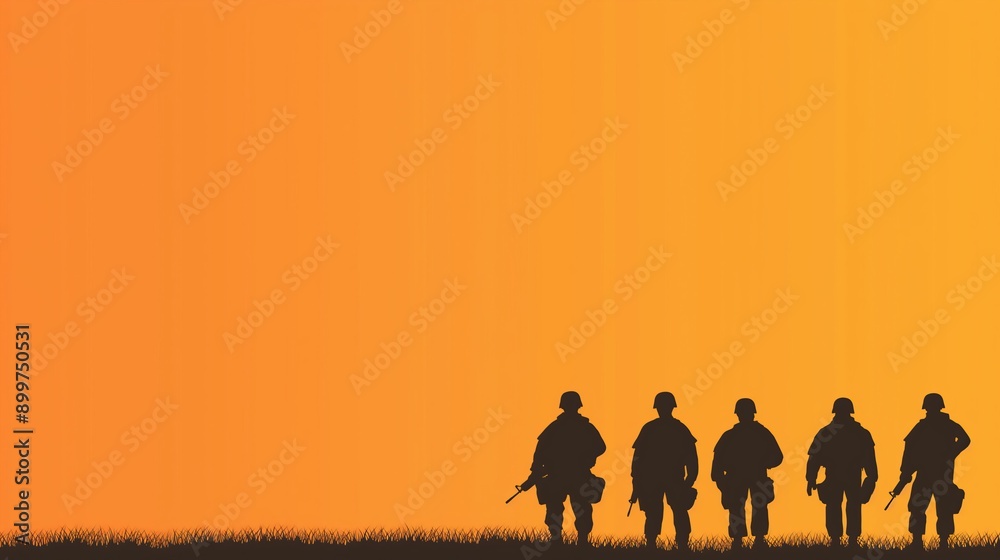 Fototapeta premium Silhouette of Soldiers Walking on Grass at Sunset with Vibrant Orange Sky Background