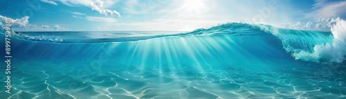 Panel kuchenny z motywem Vibrant ocean wave under the sunlight, showcasing clear blue water and gentle ripples, perfect for beach and nature themes.