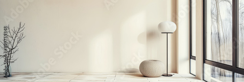 Property interiors decor composition with a standing lamp next to a large window on a minimalist living room.