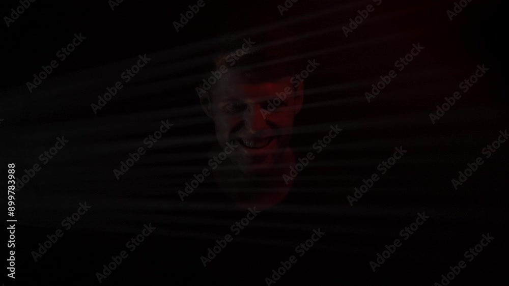 Mysterious portrait of man with light and shadow on face