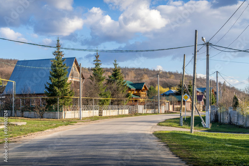 The peaceful village of Zhiguli, with the local houses and the empty road, Samara oblast, Russia.
 photo