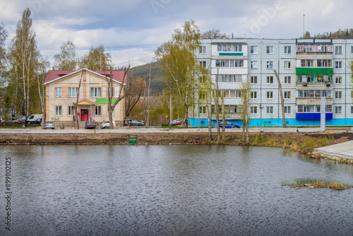 The Zhigulevsk city streets and the town pond in Samara oblast, Russia, with typical Russian architecture and grocery shop.
 photo