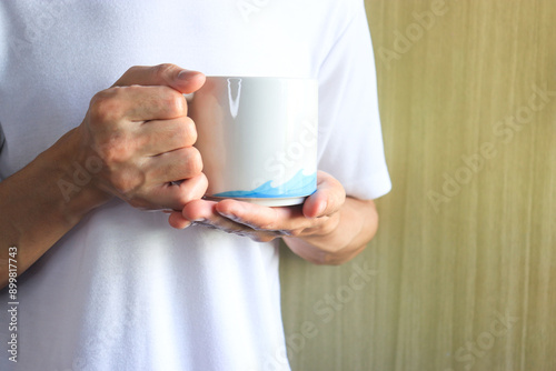 man holding a glass of water