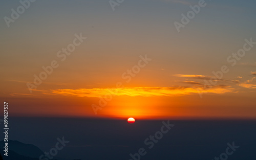 gloomy sunrise over the Mountain range  from Antu hill,   Ilam, Nepal.