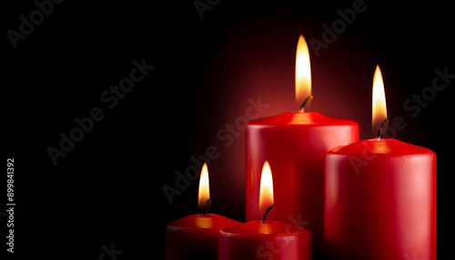 Four Red Candles Burning Brightly Against A Dark Background During A Calm Evening