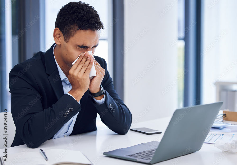 Laptop, tissue and businessman in office blowing nose for flu, cold and sinus infection. Computer, sneeze and sick male corporate attorney with sneeze for hayfever, allergies or illness in workplace.