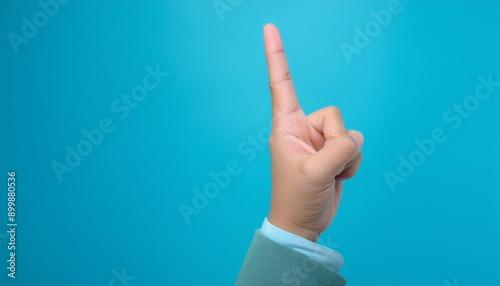 Lecturer's finger pointing to blackboard for explanation