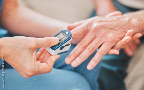 Nurse, patient hands and check oxygen in blood, measure pulse and medical tool for healthcare. Medic, person and consulting doctor in exam in hospital, oximeter and track heartbeat for hypertension photo