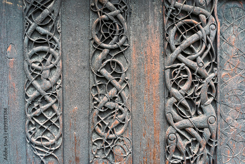 Exterior wooden carvings of the Urnes Stave Church, a UNESCO World Heritage Site, by Lustrafjorden in Norway.