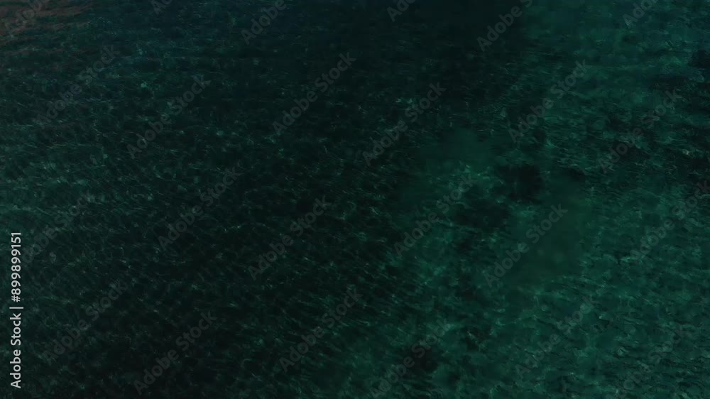 Clear transparent blue sea, boat in the sea. Aerial panorama drone view of Perissa beach near mountain, black pebble beach. Santorini Island, Greece. Aegean Sea, Mediterranean.
Clear transparent blue sea, boat in the sea. Aerial panorama drone view of Perissa beach near mountain, black pebble beach. Santorini Island, Greece. Aegean Sea, Mediterranean.