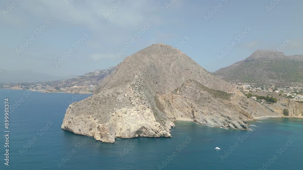 A rocky cliff overlooks the ocean. The sky is clear and the water is calm. The scene is serene and peaceful A rocky cliff overlooks the ocean. The sky is clear and the water is calm. The scene is serene and peaceful