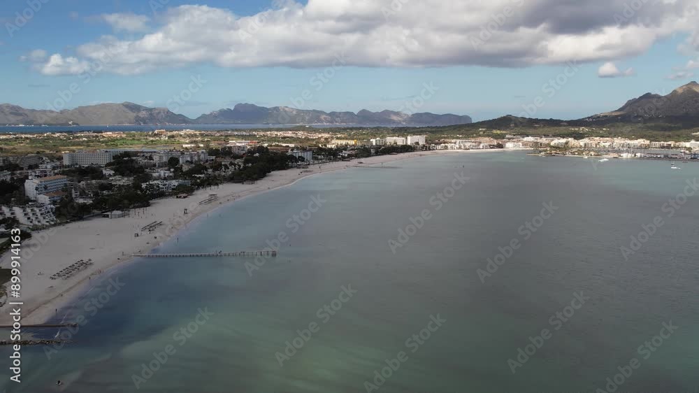 drone aerial view of beach in Alcudia in Mallorca on a sunny summer day with blue water, travel destination in Europe drone aerial view of beach in Alcudia in Mallorca on a sunny summer day with blue water, travel destination in Europe