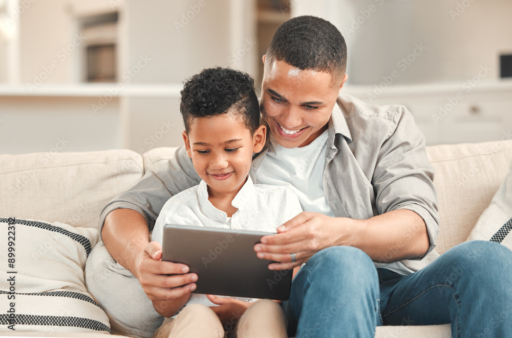 Dad, boy and happy with tablet in home on sofa on streaming website for educational games. Parent, kid and people with smile in living room for bonding, support and teaching for child development Dad, boy and happy with tablet in home on sofa on streaming website for educational games. Parent, kid and people with smile in living room for bonding, support and teaching for child development