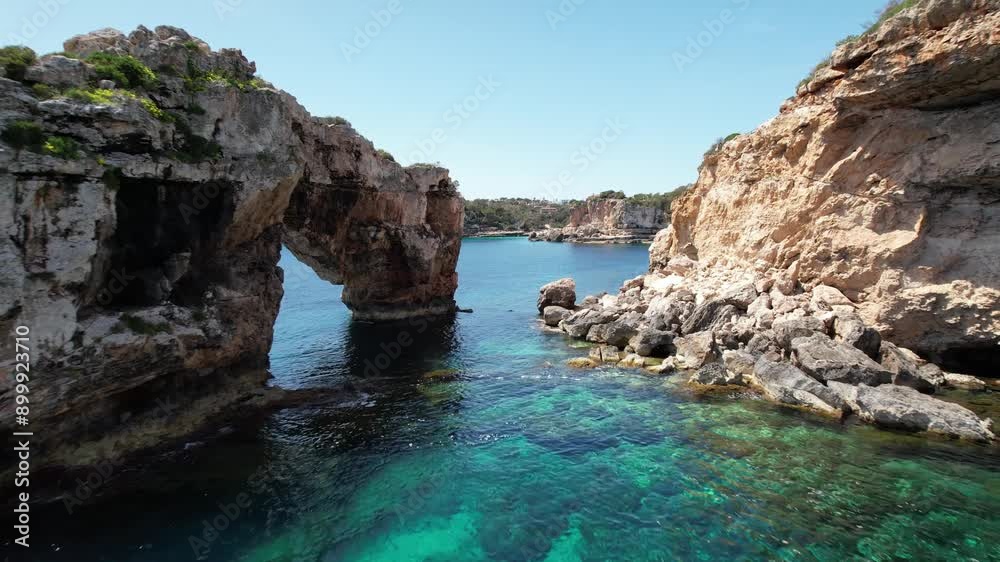 drone aerial view of beach in cala d'or in Mallorca on a sunny summer day with blue water, travel destination in Europe drone aerial view of beach in cala d'or in Mallorca on a sunny summer day with blue water, travel destination in Europe