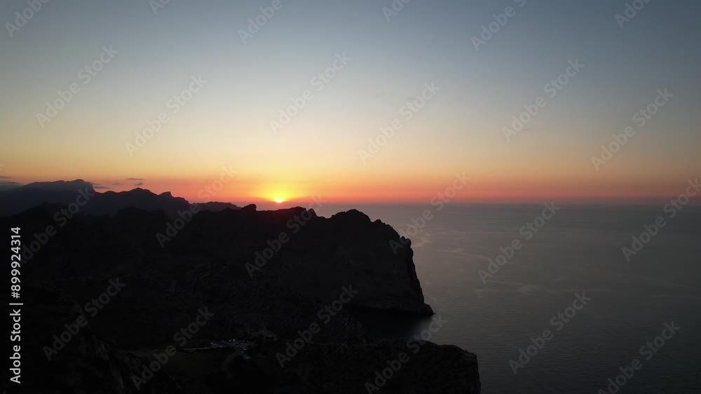 drone aerial view ofsunset in Deia in Mallorca on a sunny summer day with blue water, travel destination in Europe drone aerial view ofsunset in Deia in Mallorca on a sunny summer day with blue water, travel destination in Europe
