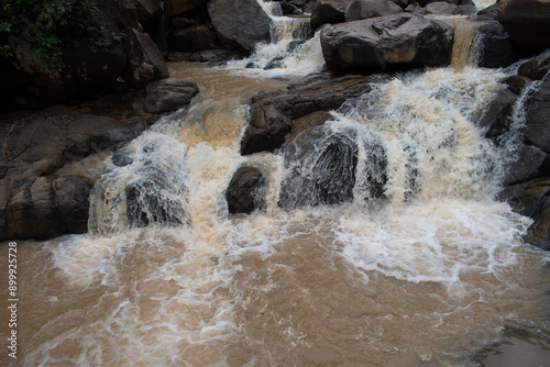 фотографія "burah river" fast flowing through the river gorge at "lodh waterfall" inside "