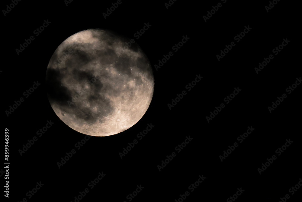 Fototapeta premium Full moon in the cloudy night sky