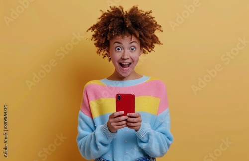 Woman Using Phone With Excited Expression