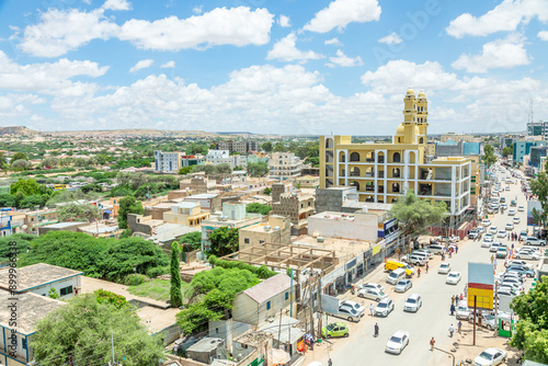 Fototapeta Naklejka Na Ścianę i Meble -  Hargeisa city downtown central street panorama with mosque and road full of cars, Somaliland, Somalia
