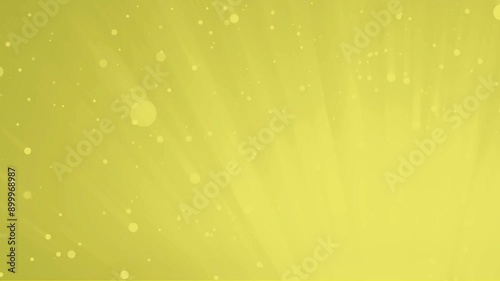 Yellow spotlight with gold light rays. Floating particles on yellow background