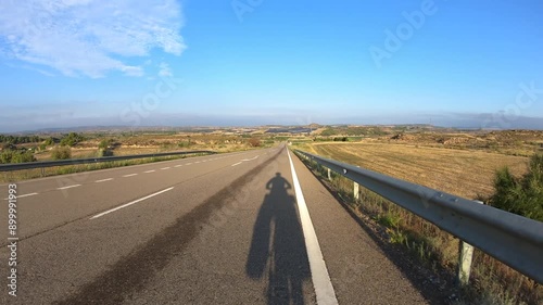 A-221 paved road with a view to the Chiprana Photovoltaic Power Complex, province of Zaragoza, Aragon, Spain photo